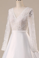 Ivory A Line Tulle Backless Wedding Dress with Long Sleeves V-neck