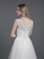 Lace wedding dress with drag and shoulder straps