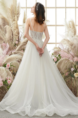 Ivory thin shoulder strap sheer and floor length wedding dress