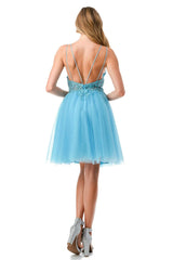 Embroidered short sleeveless dress paired with A-line skirt