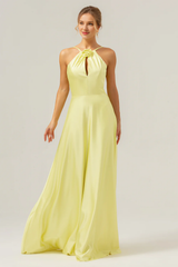 Yellow A-line hanging neck, exposed back, and floor length bridesmaid dress with flowers