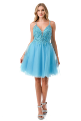 Embroidered short sleeveless dress paired with A-line skirt