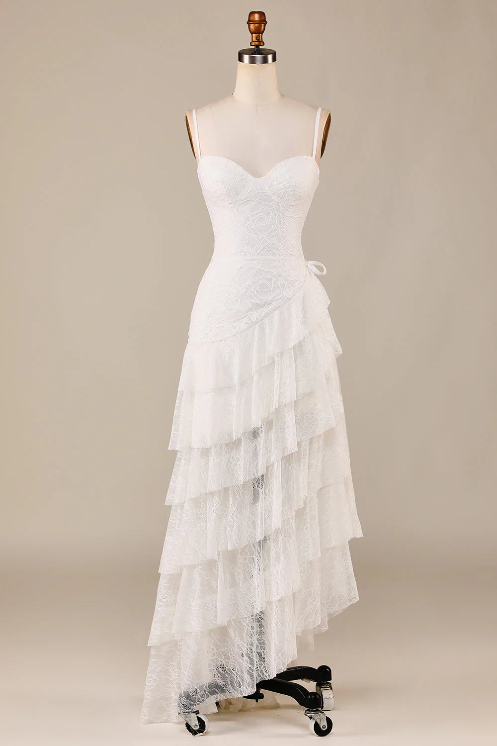 Tight fitting thin shoulder straps ivory lace asymmetrical and ground length wedding dress
