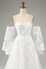 White A-line chiffon long sleeved wedding dress with applique lace