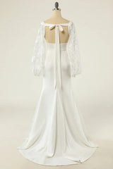 White fishtail long sleeved and floor length backless wedding dress