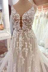 Charmante lange A-lijn spaghetti riemen appliques kant tule backless trouwjurk