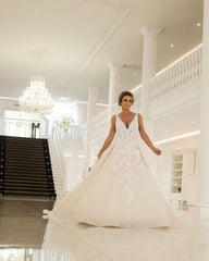 Elegant Backless A-Line Wedding Gown with Deep V-Neck and Spaghetti Straps in Applique Lace
