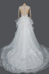 Elegant Long Sleeve Ball Gown Wedding Dress with Lace Appliques