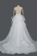 Elegant Long Sleeve Ball Gown Wedding Dress with Lace Appliques