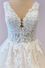 Prachtige lange a-line tule trouwjurk met appliques kant