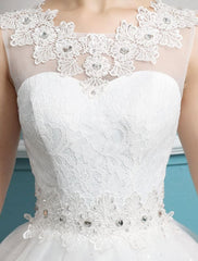 Princess Ball Gown Wedding Dresses Tulle Backless Ivory Beading Floor Length Bridal Dress