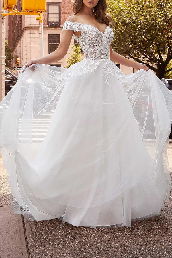 Off the shoulder lace decal with a simple white wedding dress paired with a detachable hem for the bride's dress