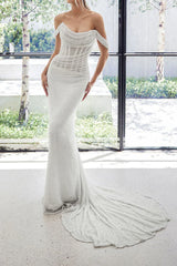 Unique off the shoulder pleated fishtail wedding dress paired with a court trailing bridal gown